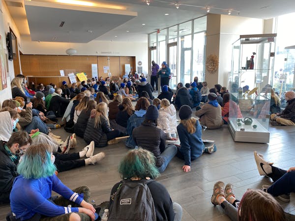 More than 100 students hold a sit-in at the district office Thursday morning.