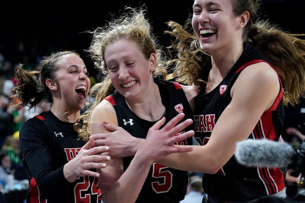 From left, Utah’s Kennady McQueen (24), Gianna Kneepkens (5) and Jenna Johnson (22) celebrated after defeating Oregon in the Pac-12 semifinals on Ma