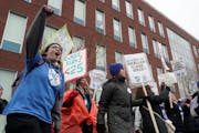 Minneapolis teachers and and support staff members continued their protest outside the Davis Education Service Center on Wednesday.