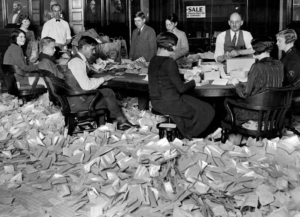 Workers in 1927 opened envelopes and counted contributions to the municipal organ fund, including many pennies, nickels, dimes, quarters, half dollars and dollars.