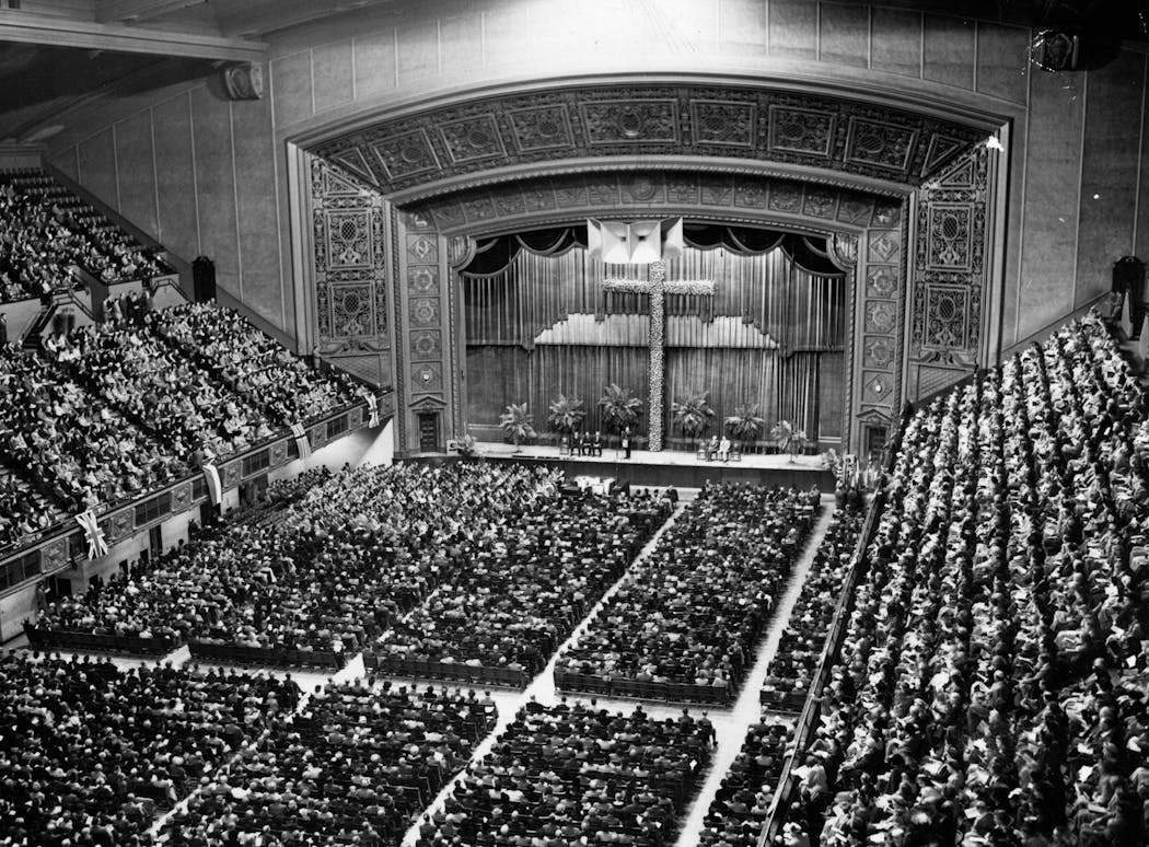 The Minneapolis Auditorium packed with guests for a Lutheran rally in 1949. The organ's pipes were concealed behind metal grillwork on each side of the stage.