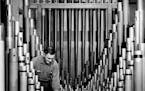 A worker tends to the Mighty Kimball organ at the Minneapolis Auditorium in 1962.