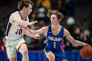 Wayzata guard Hayden Tibbits looked for a way past Cretin-Derham Hall’s Nicolas Coyle in a Class 4A semifinal at Williams Arena on Thursday night. T