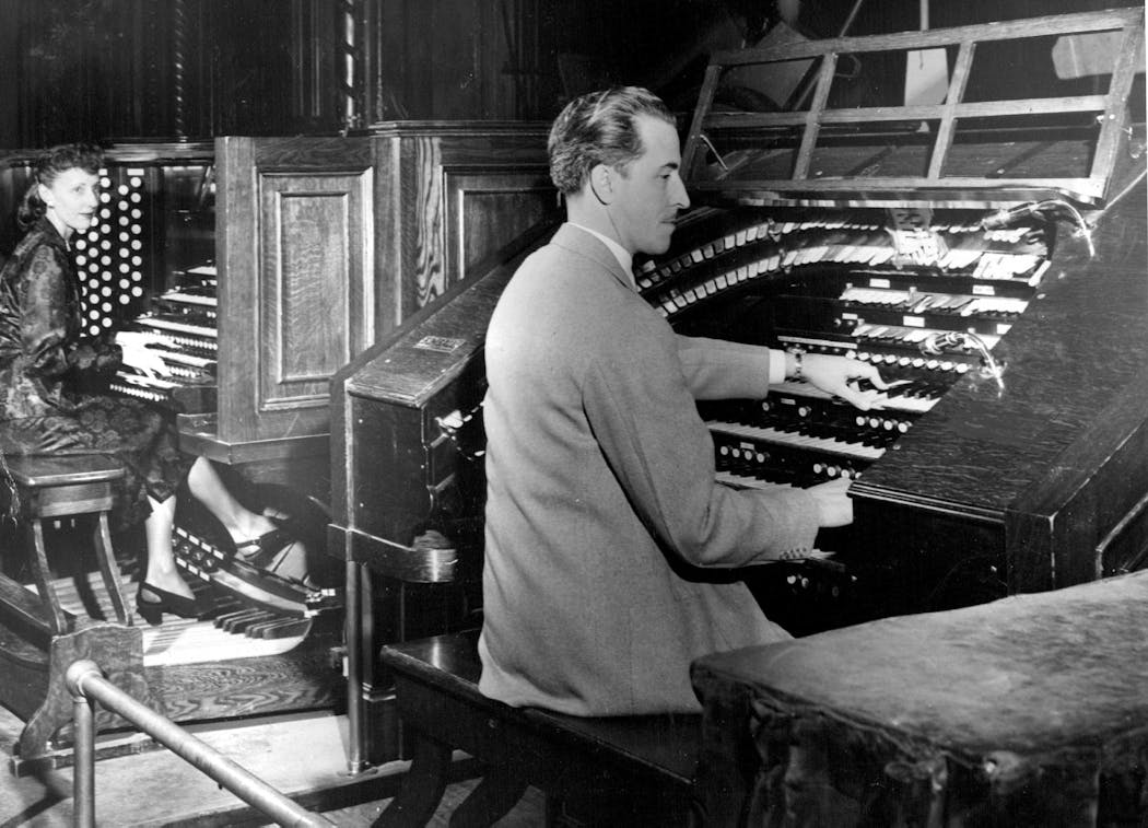 Organists Ramona Gerhard and Leonard Leigh play the concert and theater consoles, respectively, of the Mighty Kimball organ in 1947.