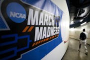 Arizona guard Shaina Pellington walked past a March Madness sign en route to her team’s locker room before playing UNLV in the first round of the NC