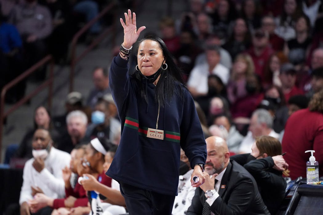 South Carolina head coach Dawn Staley communicates with players during the first half of a second-round game against Miami in the NCAA college basketball tournament, Sunday, March 20, 2022, in Columbia, S.C. South Carolina won 49-33.