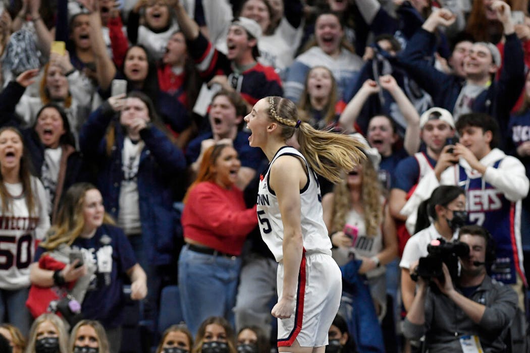 Connecticut's Paige Bueckers reacts at the end of a second-round women's college basketball game against Central Florida in the NCAA tournament, Monday, March 21, 2022, in Storrs, Conn.