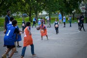 A few dozen neighborhood kids took part in a summer basketball program with plainclothes officers near St. Cloud’s COP House in June 2018. Waite Par