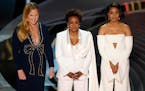 Hosts Amy Schumer, from left, Wanda Sykes, and Regina Hall appear on stage at the Oscars on Sunday, March 27, 2022, at the Dolby Theatre in Los Angele