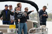 Gov. Tim Walz laughed while fishing in a traditional opening-day entourage during the 2019 Governor’s Fishing Opener in Albert Lea.