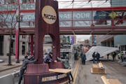 Crews installed a replica of the women’s NCAA championship trophy in front of Target Center.