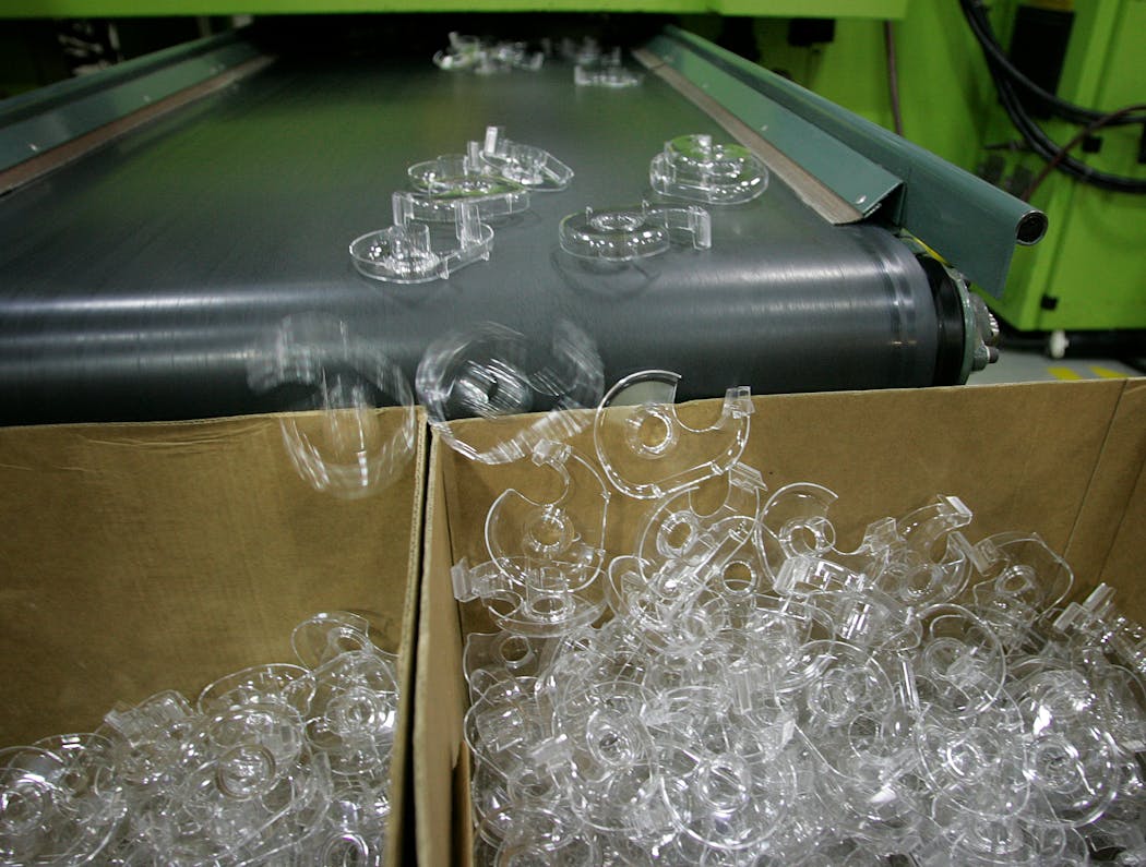 Plastic housing for 3M Scotch tape falls off a conveyer into boxes at the 3M tape plant in Hutchinson, Minn. in 2005.