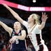 UConn guard Paige Bueckers shoots against Stanford forward Cameron Brink. The former Hopkins star scored 14 poibts for UConn.