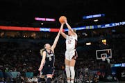 UConn guard Paige Bueckers defends Stanford guard Lexie Hull during Friday’s semifinal at Target Center. Hull missed all four of her three-point att