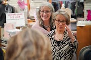Personal stylist Nancy Dilts, left, assisted financial worker Stephanie Hoepner with updating her office wardrobe at Elite Repeat in St. Paul.