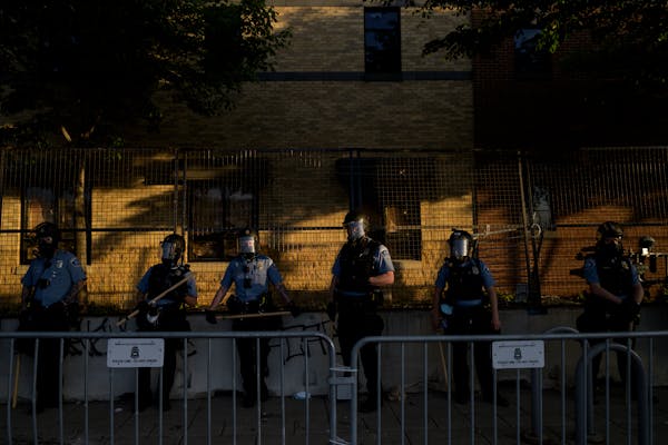 Minneapolis police outside the Third Precinct station during a 2020 protest. Since the police murder of George Floyd, 130 Minneapolis officers have ma