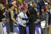 Geno Auriemma and Dawn Staley shook hands after a game at UConn.