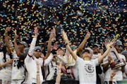 South Carolina head coach Dawn Staley, right, reacts during the trophy presentation in the NCAA WomenÕs Final Four on Sunday, April 3, 2022 at Target