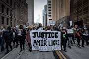 Amir Locke’s killing renewed a national debate on the use of no-knock warrants. Demonstrators, shown on Feb. 5, 2022, outside the Hennepin County Go