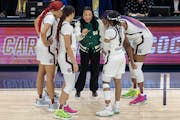 South Carolina coach Dawn Staley huddled with her players during Sunday’s NCAA championship game at Target Center.