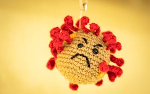 A coronavirus made from a pin cushion decorated the entrance of the intensive care unit at Regions Hospital in St. Paul.
