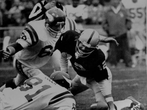 Doug Sutherland went in for a sack of Oakland quarterback Ken Stabler during a game in 1977