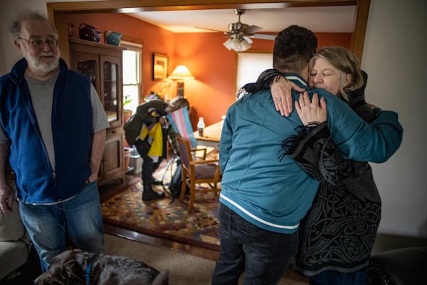 The Rev. Michelle Hargrave hugged her son, Zane, as husband Kelly and daughter Liz looked on. Brain fog and fatigue were common challenges for weeks a