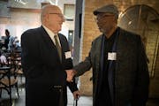Ziggy Kauls, left, greeted Larry McKenzie at the Minnesota Basketball Hall of Fame induction ceremony. Kauls coached 45 years at Mounds View; McKenzie
