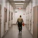 “Surprisingly to many of us, long prison sentences are not what victims need,” Bruce Peterson writes. Above, a deputy walks down the hallway of th