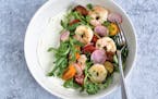 A snappy shrimp salad sits atop a swipe of creamy feta for a springtime salad. 