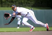 The Twins Luis Arraez fielded a ground ball at second base against Seattle above, but was at first base Tuesday in Kansas City.