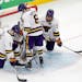 Minnesota State’s Jack McNeely (3), Sam Morton (6) and Wyatt Aamodt (7) stood by goalie Dryden McKay after the team’s loss to Denver in the NCAA m