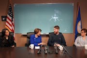 Sen. Amy Klobuchar talks with Minnesota native Tyler Jacob during a news conference Tuesday. Jacob was recently released after being detained by Russi