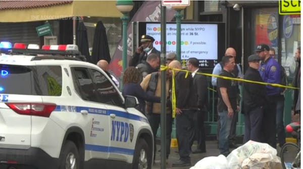 Police hunt gunman who wounded 10 in Brooklyn subway attack