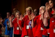 A group of fourth-year AmeriCorps tutors raised their right hands as they took the program’s pledge in 2018.