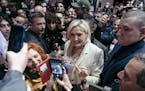 Marine Le Pen greets supporters of her nationalist party during a presidential campaign rally in Stiring-Wendel, France, on April 1.