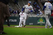 Los Angeles catcher Austin Barnes rounded third base after hitting the third of three consecutive Dodgers home runs off Dereck Rodriguez.