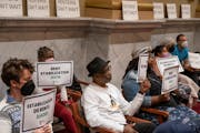 Minneapolis renters Jon Wills, left and Kiesha Steele with others attended the Minneapolis City Council meeting with hopes of a rent stabilization sol