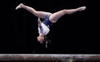 Auburn’s Suni Lee competes on the balance beam during the NCAA women’s gymnastics championships Thursday in Fort Worth, Texas.