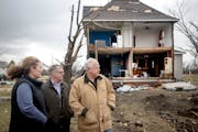 Minnesota Governor Tim Walz takes a tour of what is left of Taopi alongside Mower County Emergency Manager Amy Lammey, left, and State Emergency Manag