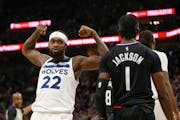 Minnesota Timberwolves guard Patrick Beverley (22) flexes in front of Los Angeles Clippers guard Reggie Jackson (1) during an NBA basketball game Tues