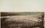 Benjamin Franklin Upton’s 1862 photograph shows river mist shrouding Fort Snelling’s fenced yard of tepees where Dakota refugees were being held a