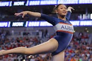Auburn’s Suni Lee competes in the floor exercise during the NCAA women’s gymnastics championships Saturday in Fort Worth, Texas.