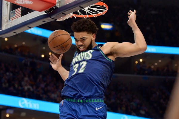 Minnesota Timberwolves center Karl-Anthony Towns (32) dunks the ball during Saturday’s Game 1 victory.