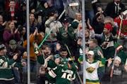 Kevin Fiala (22) and Jared Spurgeon (46) of the Wild celebrates a game-winning overtime goal by Spurgeon on Sunday at Xcel Energy Center