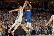 Minnesota Timberwolves forward Anthony Edwards (1) shoots against Memphis Grizzlies guard Desmond Bane (22) in the second half of Game 1.
