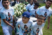 Relatives gathered in September for a funeral service for Marcoz, 14, one of two teens killed in a crash during a high-speed chase. His mother, Tanya 