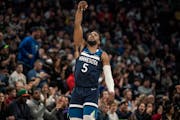 Minnesota Timberwolves guard Malik Beasley (5) celebrates his 3 point score late in the 4 quarter in Minneapolis, Minn., on Tuesday, March 1, 2022. 
