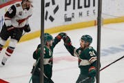 Winger Kevin Fiala and defenseman Matt Dumba (24) celebrated a Wild goal last season, but salary cap issues this offseason might force the team to kee