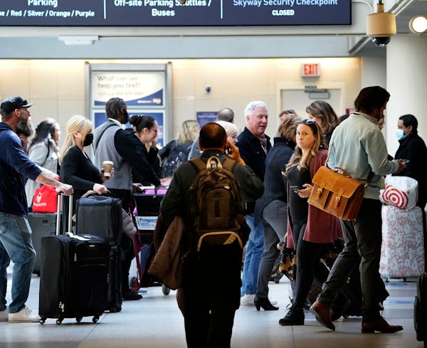 Masks were optional at Minneapolis-St. Paul International Airport on Tuesday. A federal judge struck down the transportation mandate, prompting airlin
